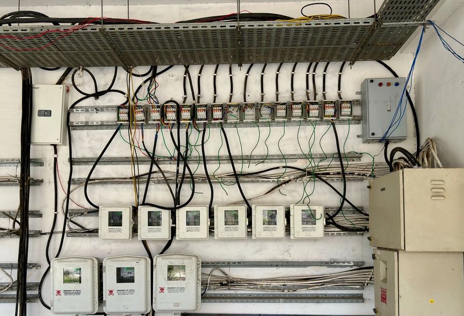 Electrical Services, complex network of electrical wiring and control panels in an industrial setting